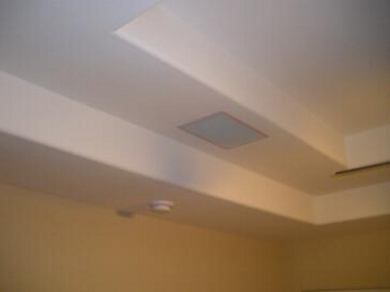 Installed left in-ceiling speaker completed with speaker grill installed